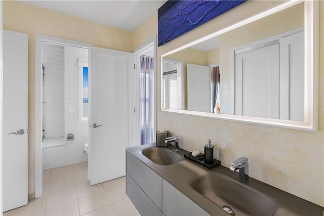 bathroom featuring tile patterned floors, vanity, and toilet