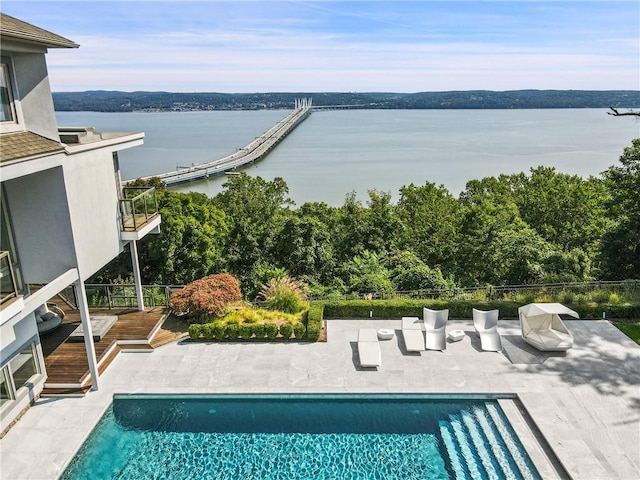 exterior space featuring a water view and a patio