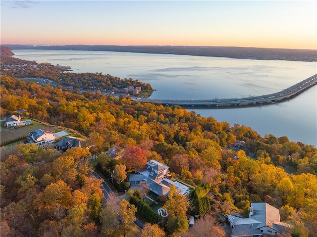 aerial view at dusk with a water view