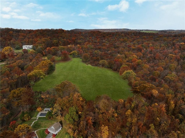 birds eye view of property with a wooded view