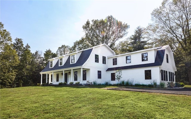 view of front of home featuring a porch and a front yard