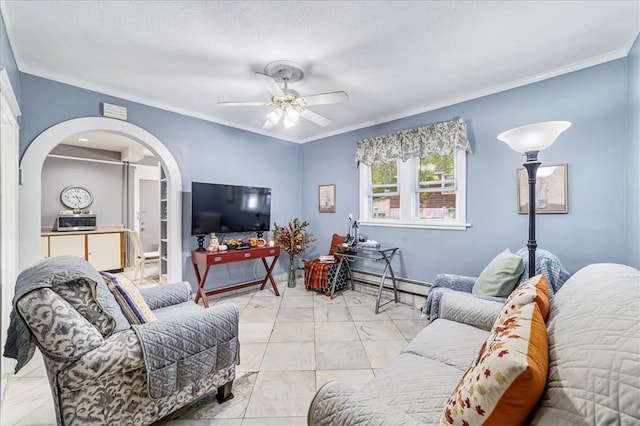 living room featuring baseboard heating, ceiling fan, crown molding, and light tile patterned floors