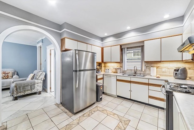 kitchen featuring light countertops, electric range, freestanding refrigerator, a sink, and dishwasher