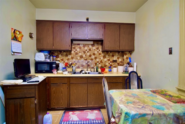 kitchen featuring sink and decorative backsplash