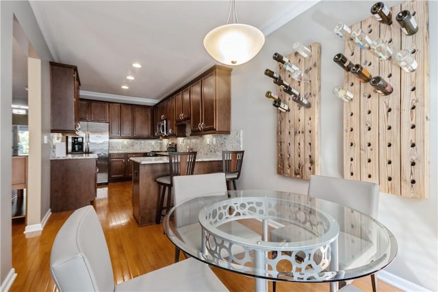 dining space featuring light wood-type flooring