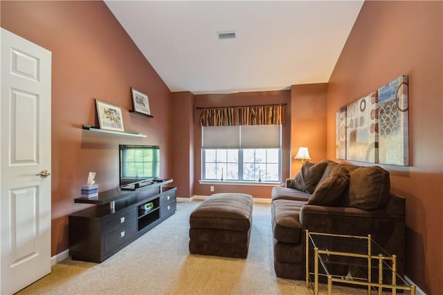 living room featuring carpet and vaulted ceiling