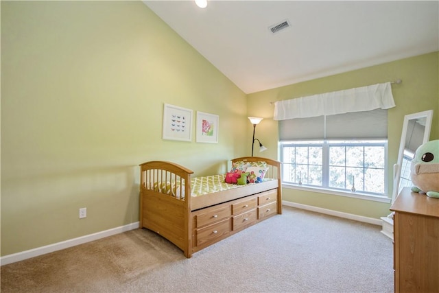 carpeted bedroom with vaulted ceiling