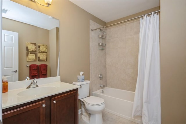 full bathroom with tile patterned flooring, shower / tub combo with curtain, vanity, and toilet