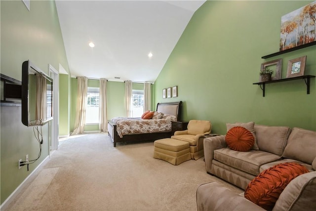 bedroom featuring light colored carpet and high vaulted ceiling