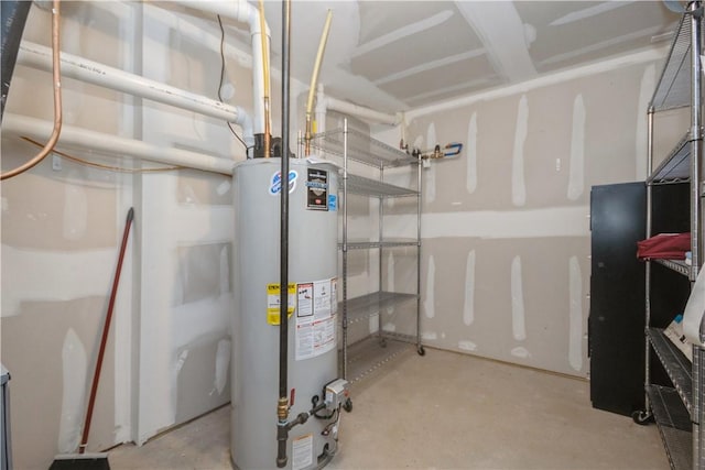 utility room featuring water heater