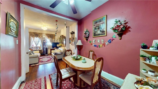 dining area featuring hardwood / wood-style floors and ceiling fan