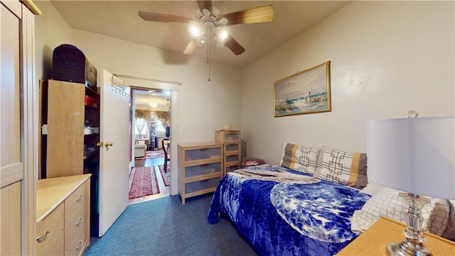 carpeted bedroom with ceiling fan