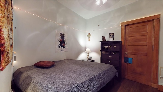 bedroom featuring ceiling fan and dark hardwood / wood-style floors