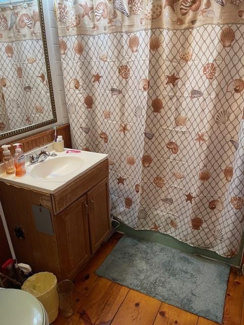 bathroom featuring wooden walls