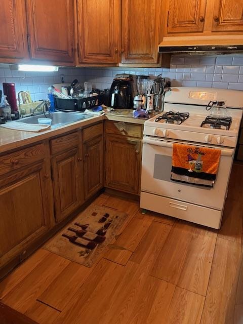 kitchen with wood walls and white cabinetry