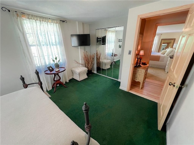 bedroom featuring dark carpet and a closet