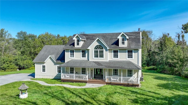 view of front facade featuring a front lawn and a porch