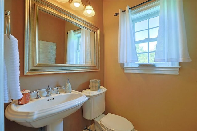 bathroom with sink and toilet