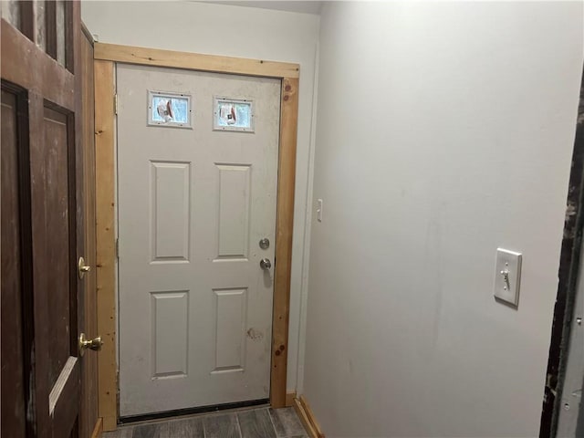 entryway with dark wood-type flooring