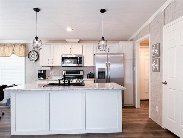 kitchen with light stone countertops, stainless steel appliances, dark hardwood / wood-style flooring, an island with sink, and white cabinets