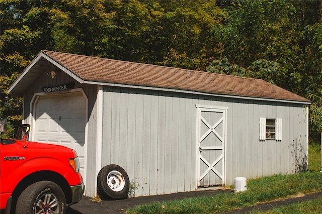 view of outbuilding featuring a garage