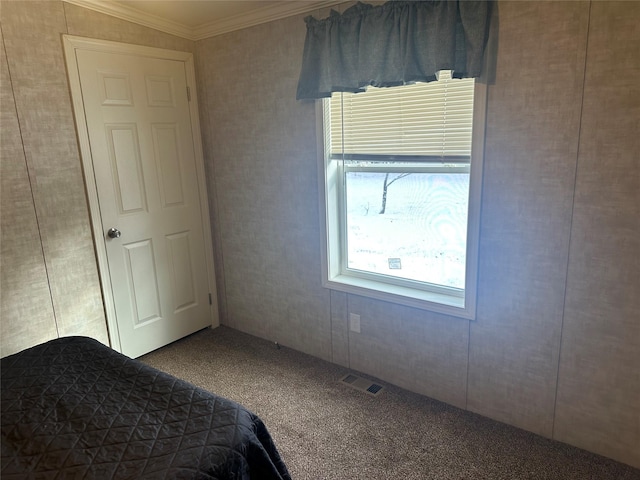 unfurnished bedroom featuring carpet and ornamental molding