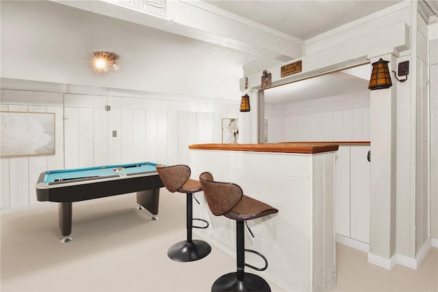 rec room featuring wood walls, pool table, and indoor bar