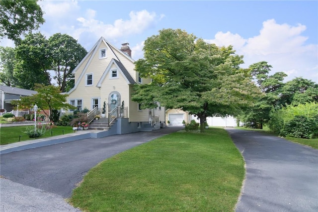 view of front facade with a front lawn and a garage