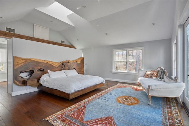 bedroom featuring dark wood-type flooring, high vaulted ceiling, and a skylight