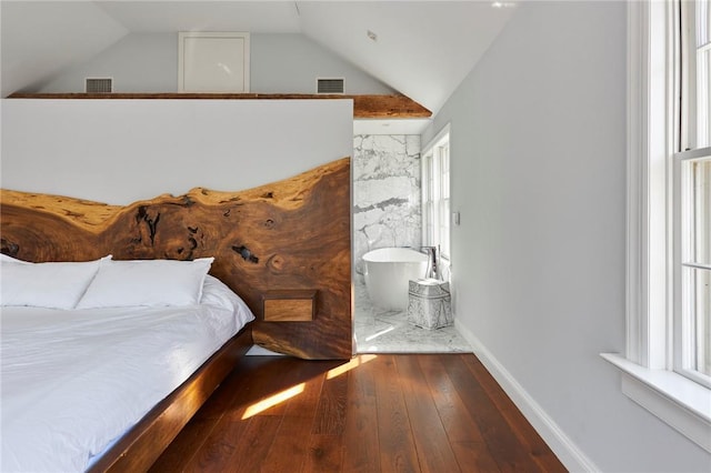 bedroom featuring wood-type flooring and vaulted ceiling