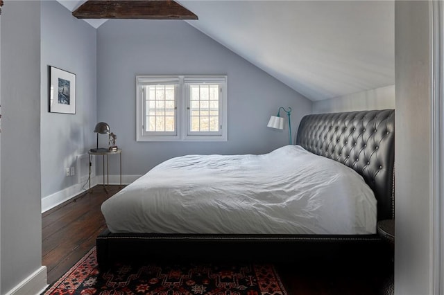 bedroom featuring vaulted ceiling with beams and dark wood-type flooring