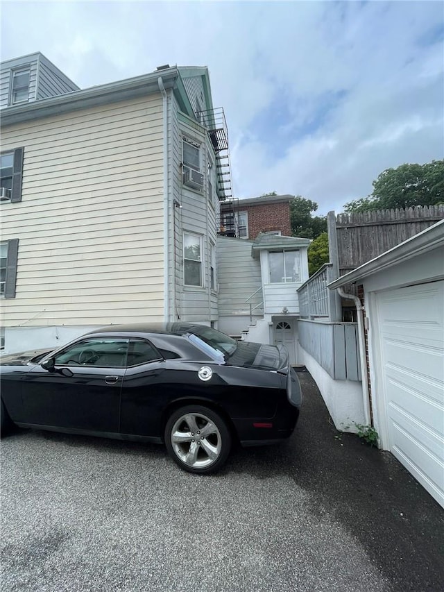 view of side of home featuring a garage