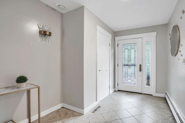 tiled entrance foyer with a baseboard radiator