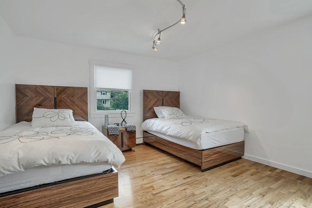 bedroom with light wood-type flooring