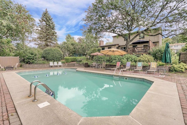 view of swimming pool featuring a patio area