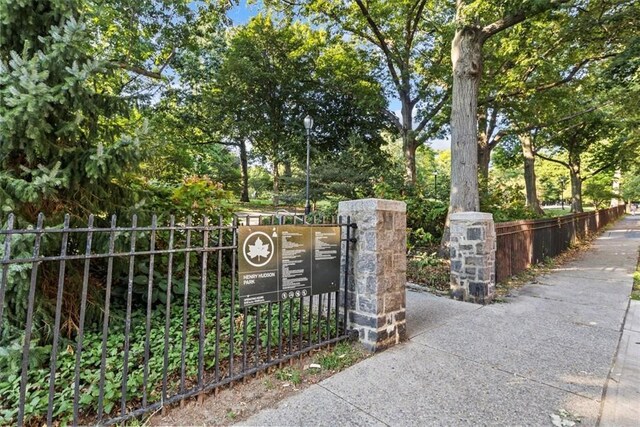 2575 Palisade Ave Unit 2G, Bronx, NY 10463 - gate featuring view of wooded area