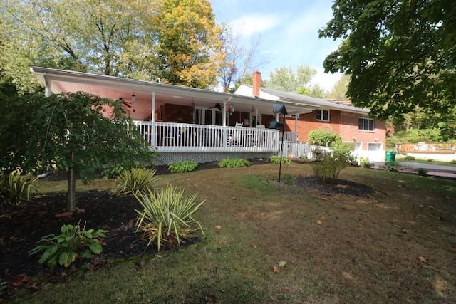 view of front of home with a front yard and a garage