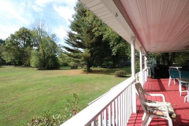 exterior space with a lawn, a grill, and covered porch