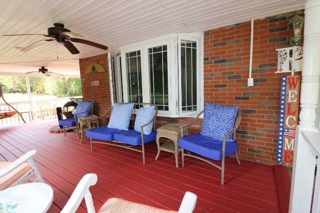 wooden deck featuring ceiling fan