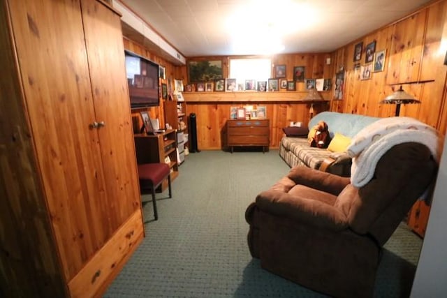 living room with light colored carpet and wooden walls