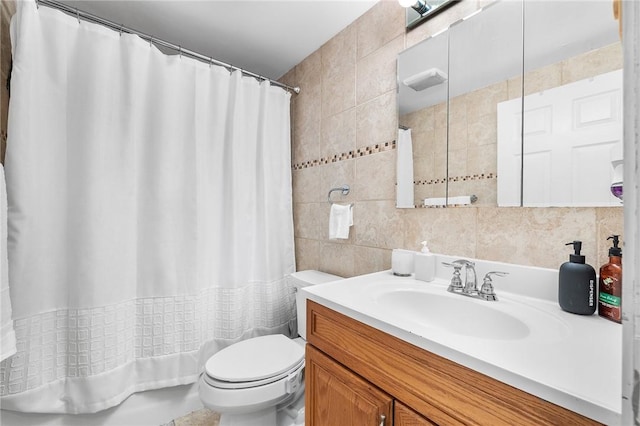 full bathroom featuring decorative backsplash, vanity, tile walls, and toilet