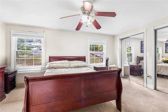 bedroom featuring ceiling fan and light carpet