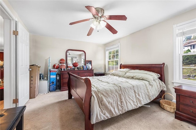 carpeted bedroom with ceiling fan