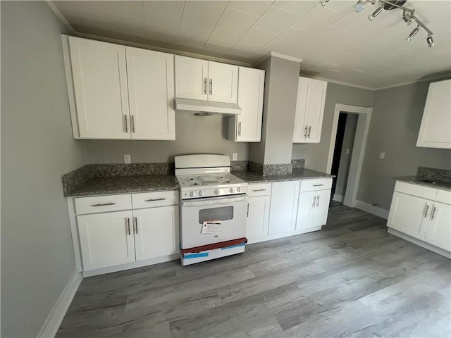 kitchen with white cabinetry and white stove