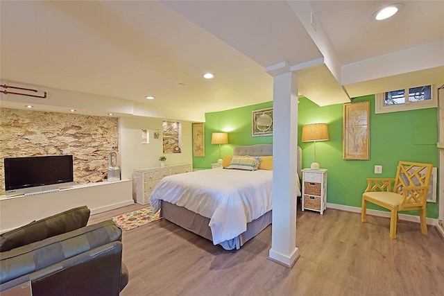 bedroom with wood-type flooring