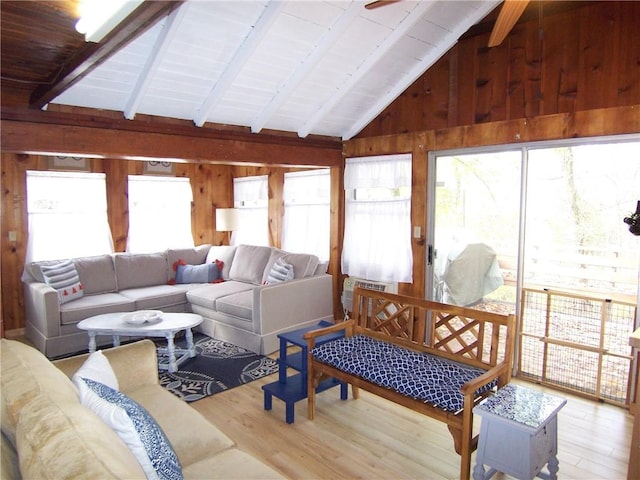 sunroom / solarium with vaulted ceiling with beams