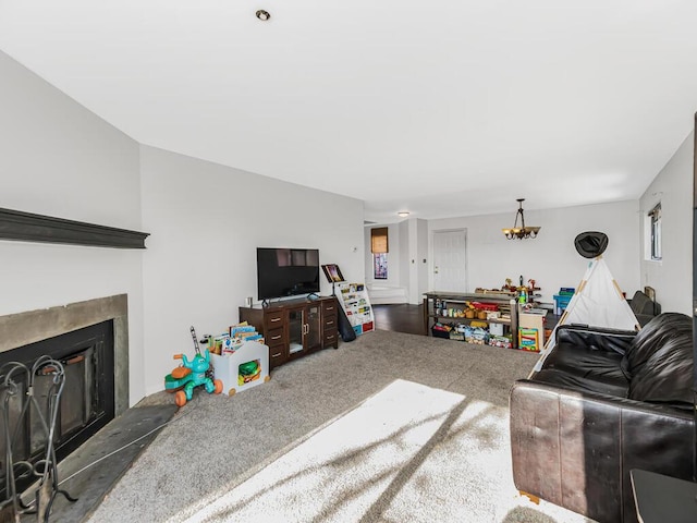 carpeted living room with an inviting chandelier