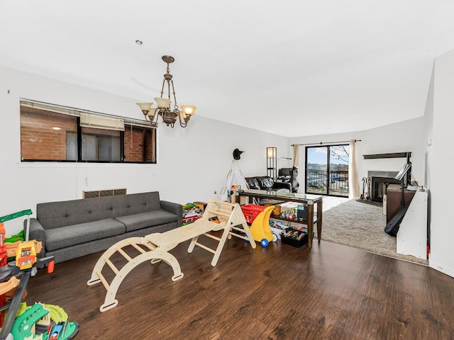 living room featuring hardwood / wood-style floors and an inviting chandelier