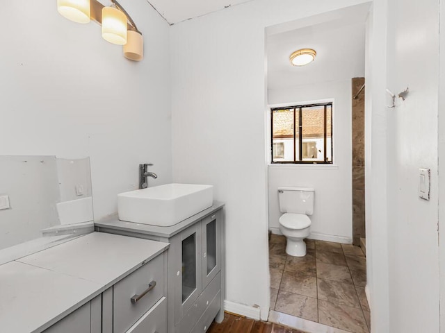 bathroom featuring toilet and sink