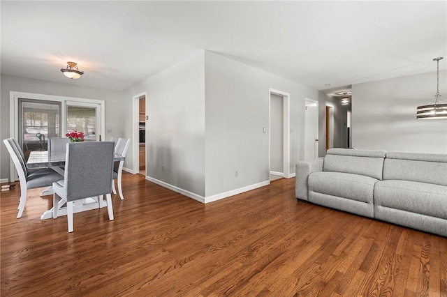 living room featuring hardwood / wood-style floors and an inviting chandelier